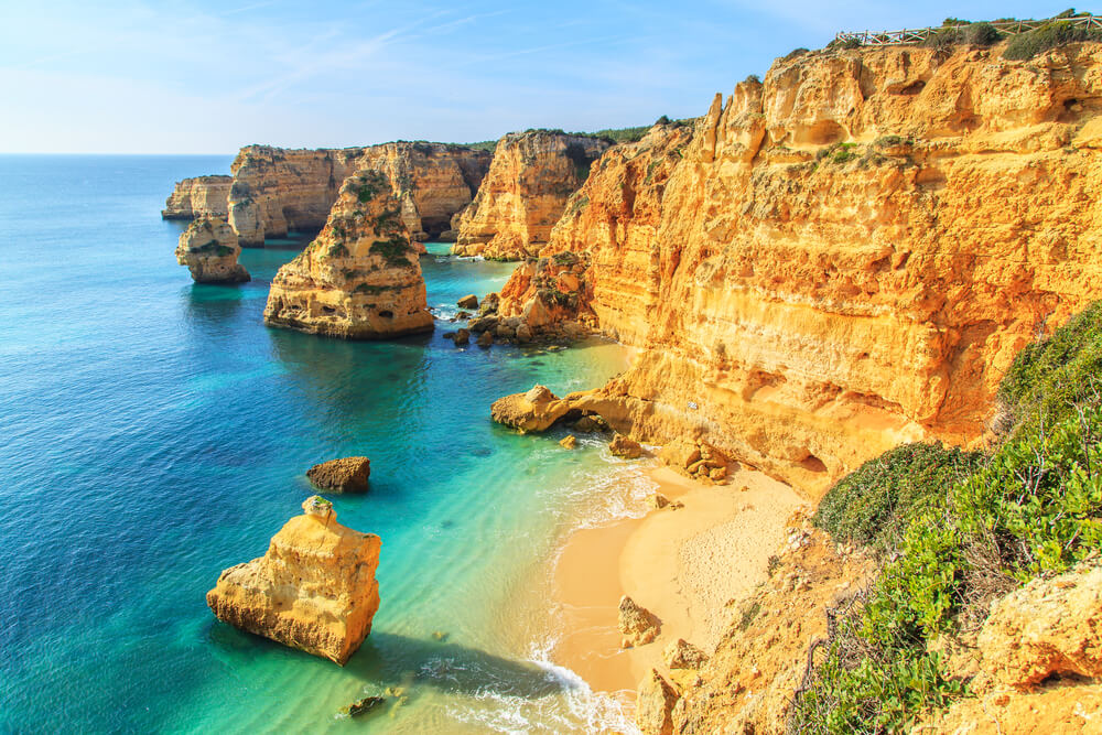 This beach is one of the most beautiful beaches in Portugal, located in between of golden cliffs
