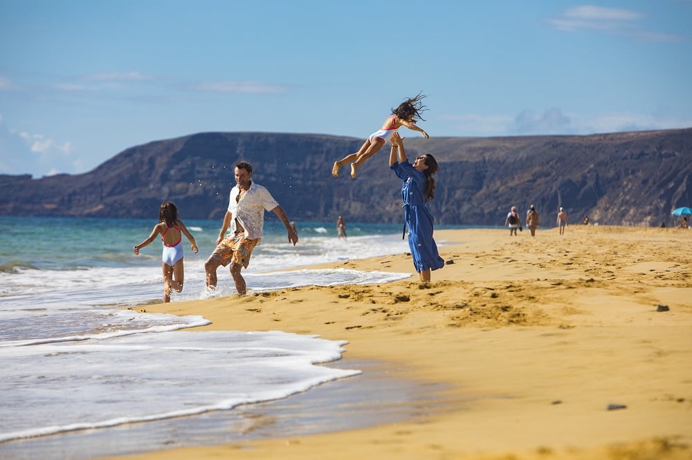 A family enjoying the Porto Island beach in Madeira