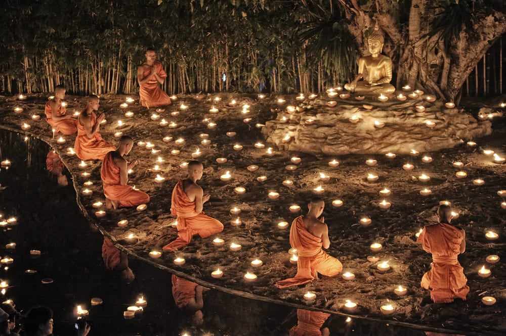 Buddhist monks praying in Thailand